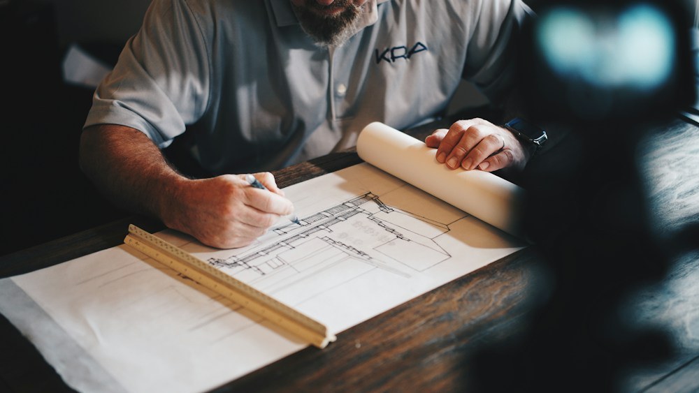 Real photograph of architectural plans being reviewed